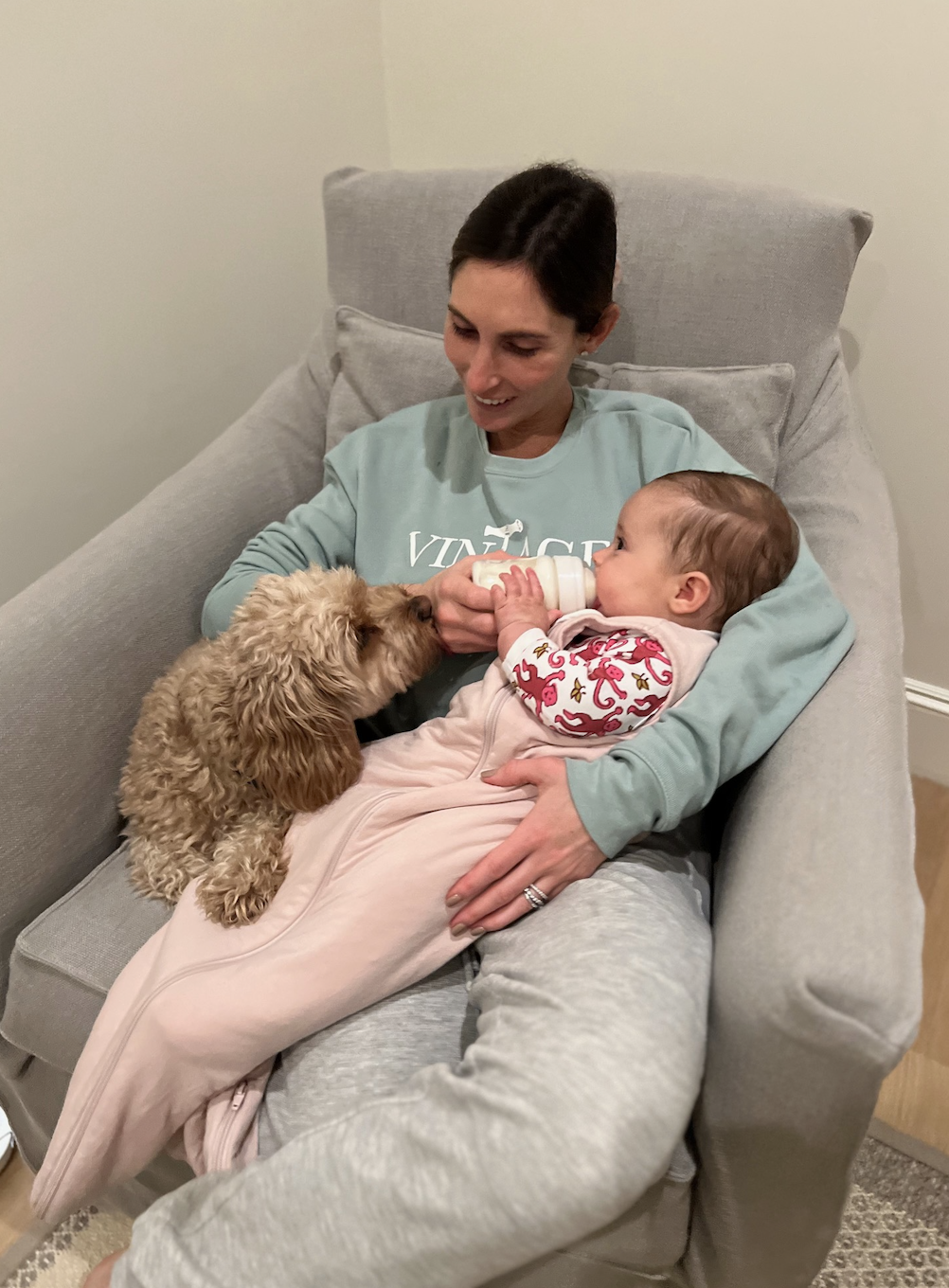 Feeding my baby a bottle with the help of my dog