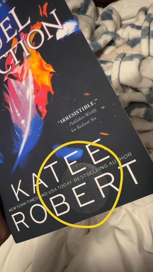 Sticker residue left behind on a book cover circled in yellow