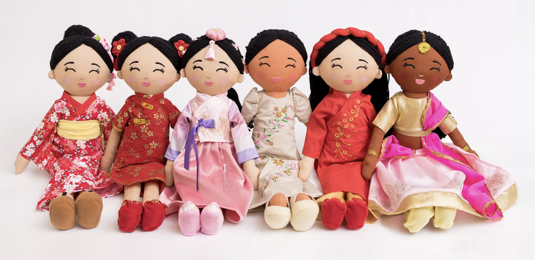 Six cultural dolls wearing beautiful traditional garments