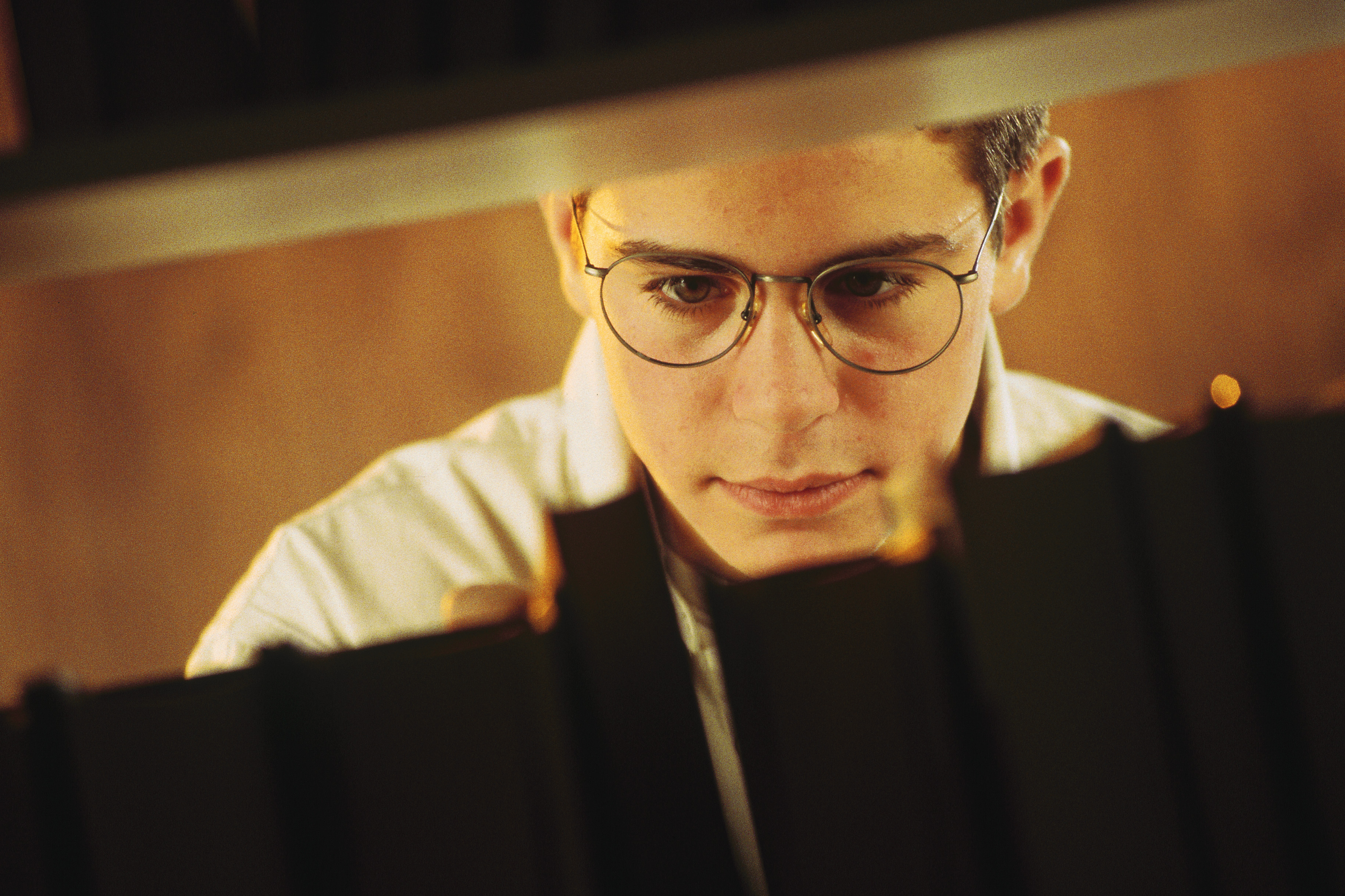 Closeup of a young man in a library