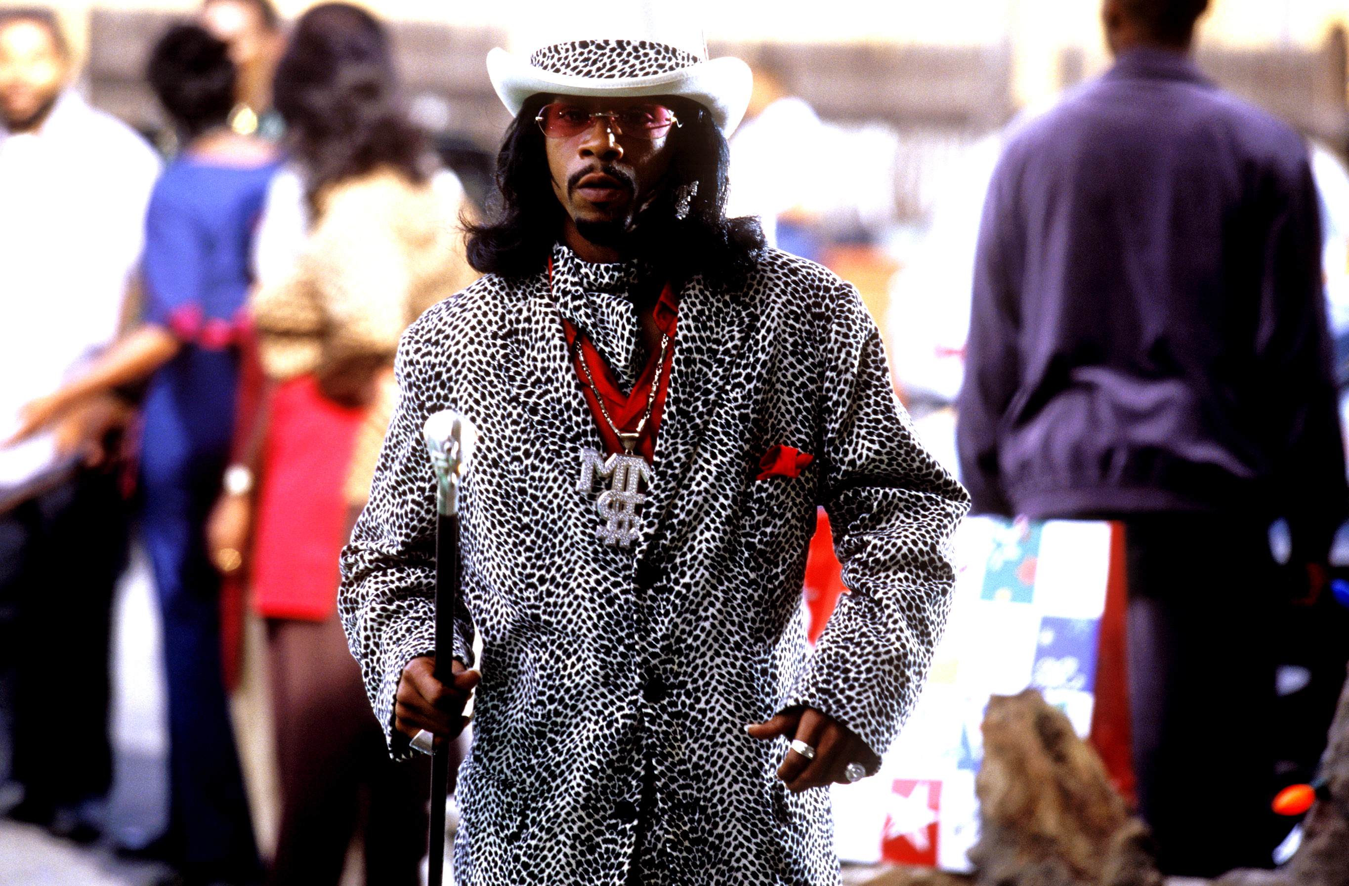 A closeup of Money Mike holding a cane in a scene from &quot;Friday After Next&quot;