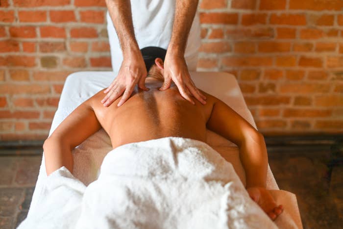 person getting massaged by massage therapist