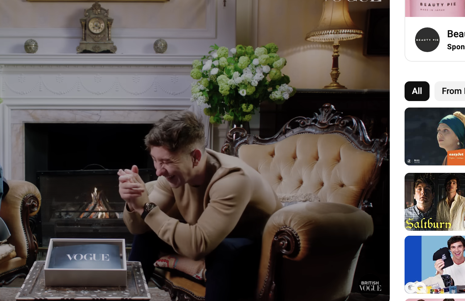 Jacob and Barry sitting and laughing together in front of a fireplace