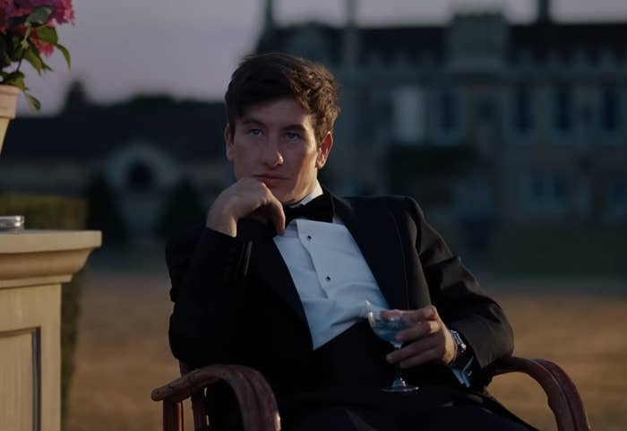 Barry as Oliver seated, wearing a bow tie, and holding a glass