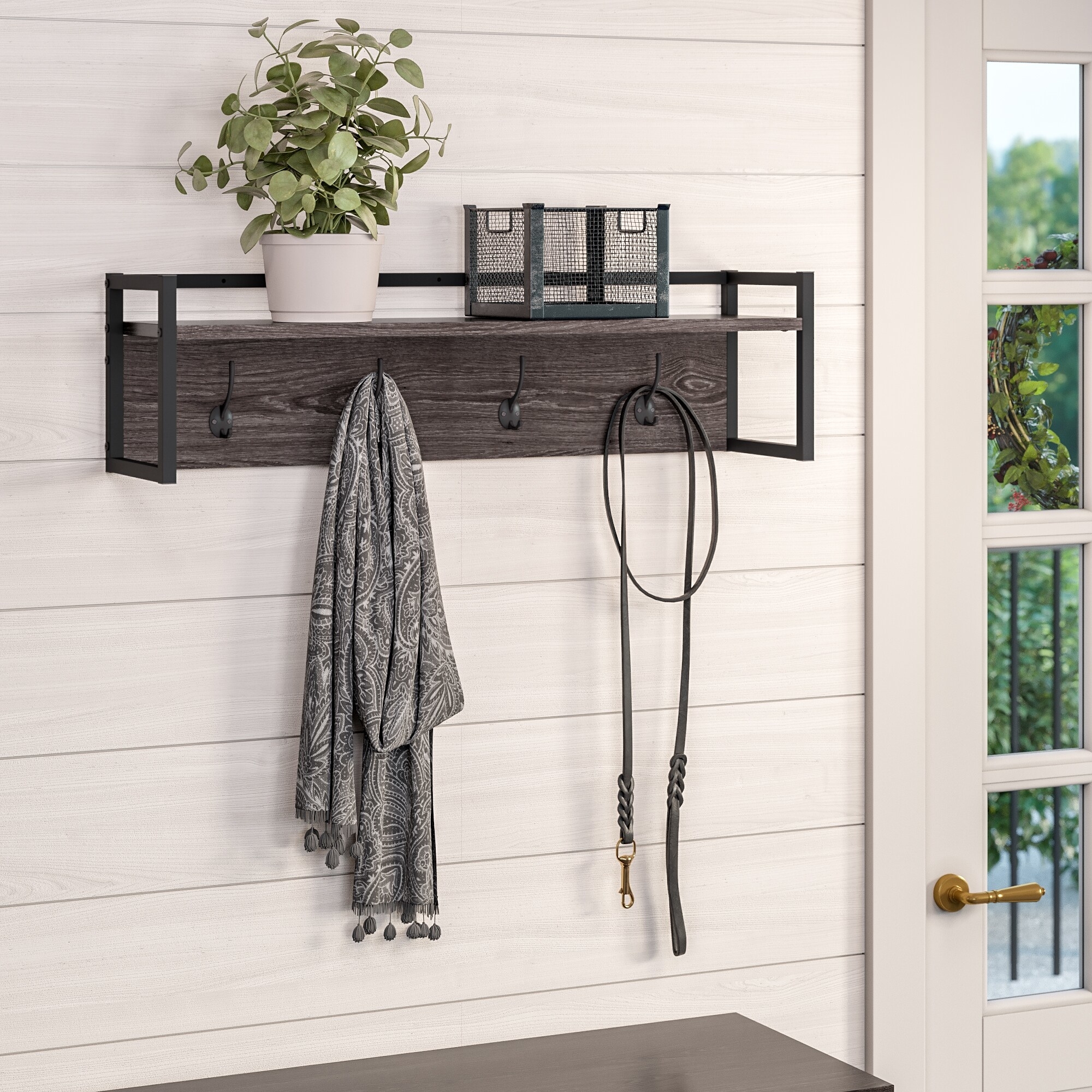 gray hanging coat rack with a shelf and four hooks