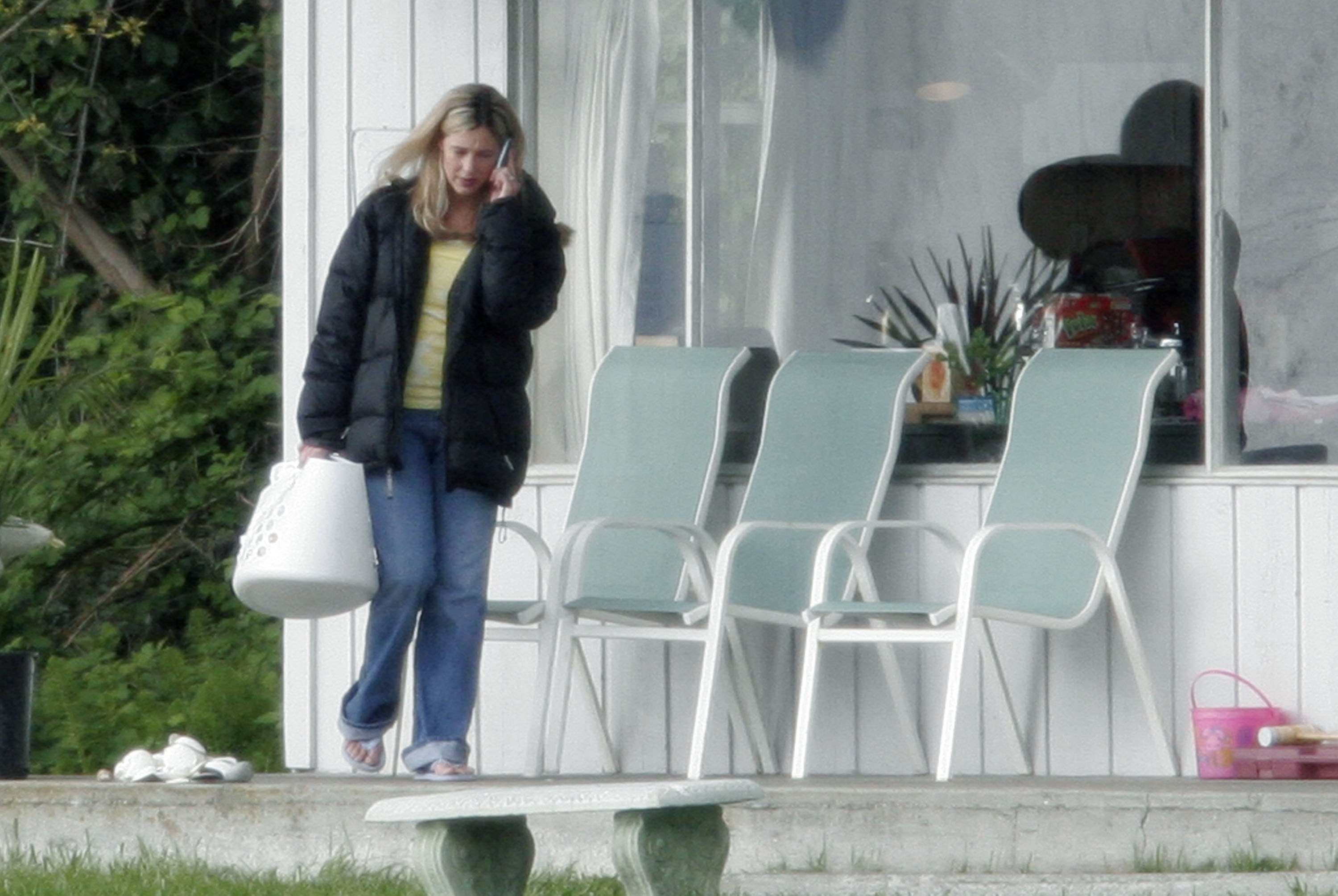 Mary Kay Letourneau walking outside while talking on the phone