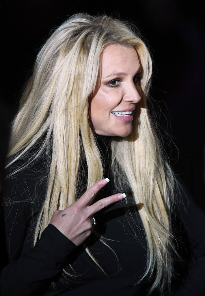 Britney giving the peace sign