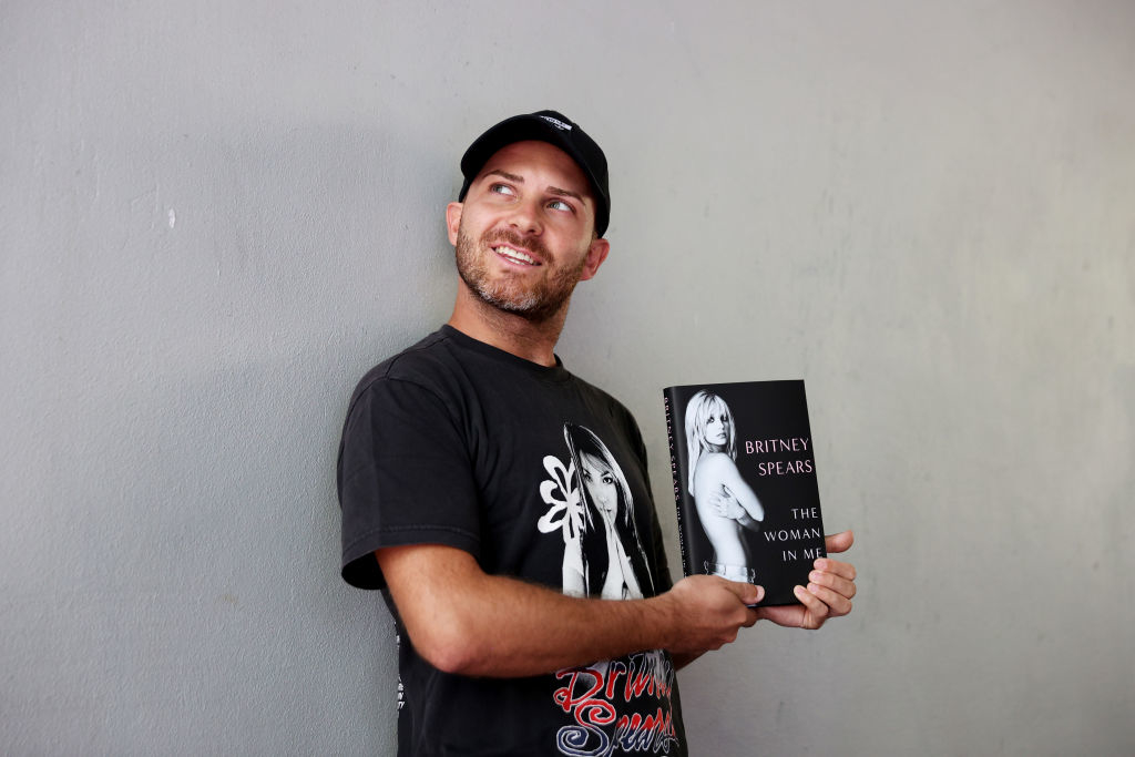 A person holding Britneys memoir