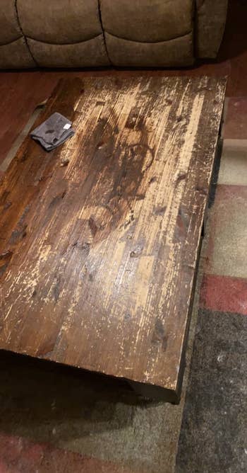 reviewer's before pic of table with worn away finish