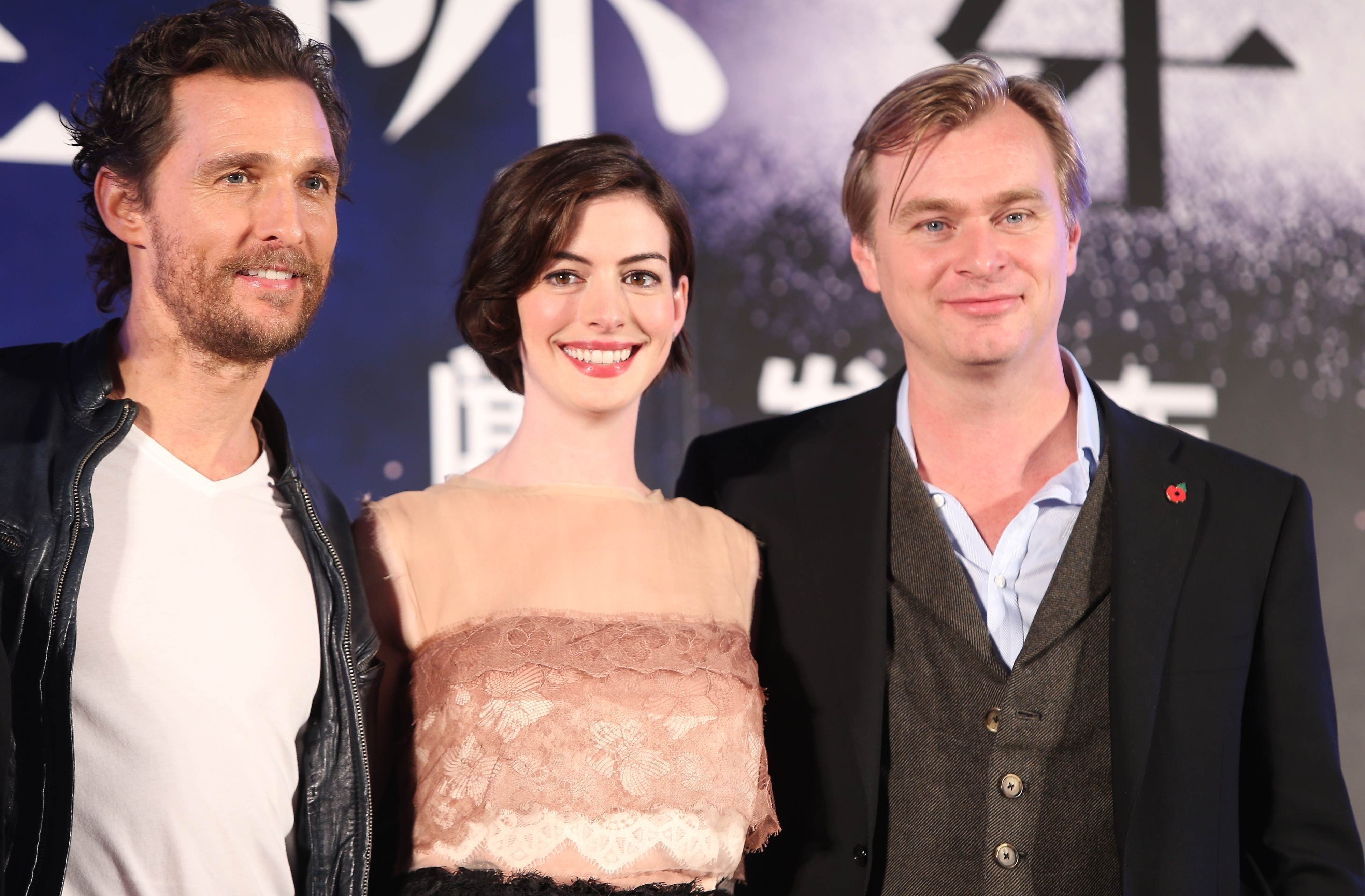 Christopher with Interstellar costars Matthew McConaughey and Anne Hathaway