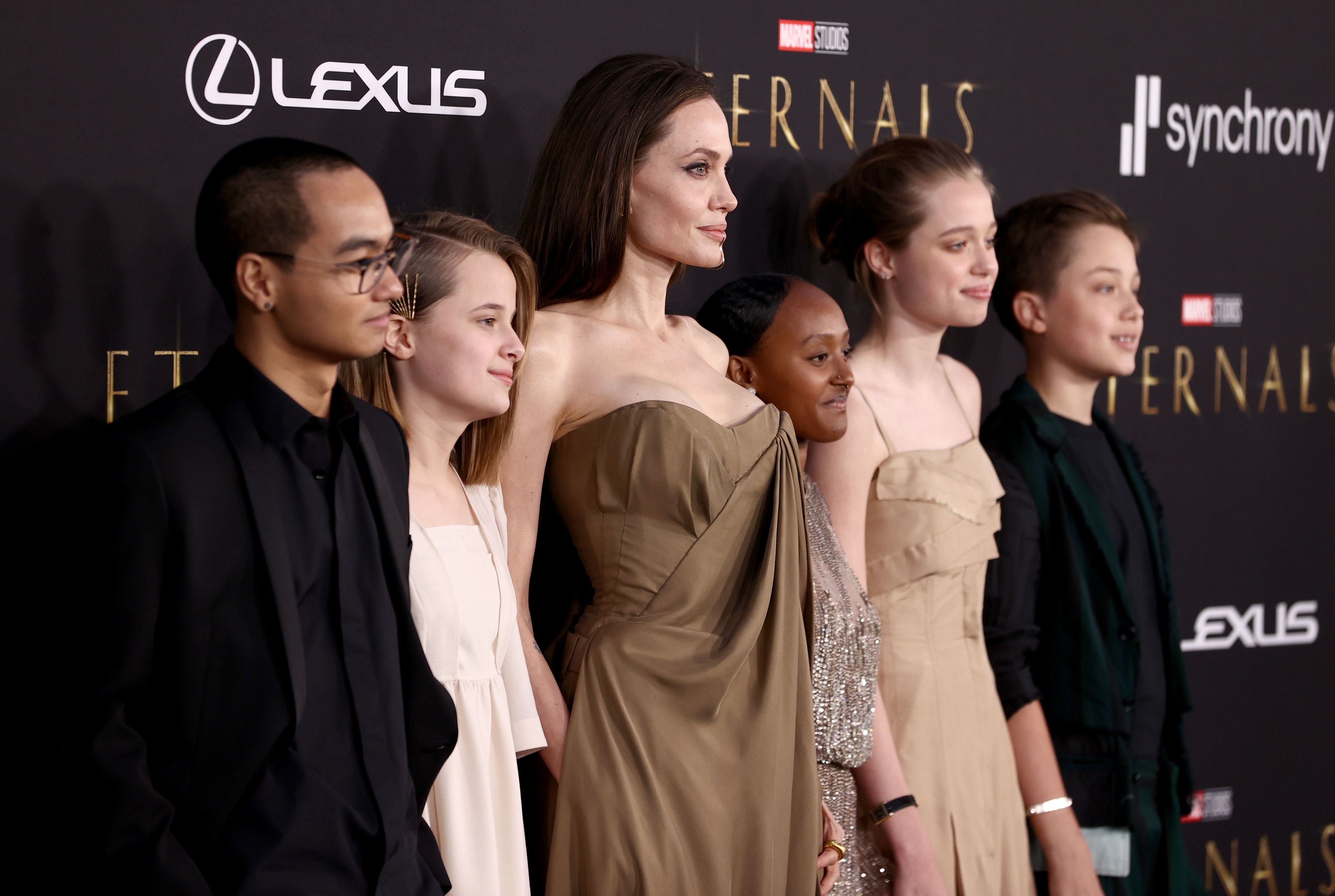 closeup of her with her children on the red carpet