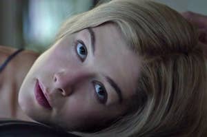 Rosamund Pike looking up as Amy in Gone Girl