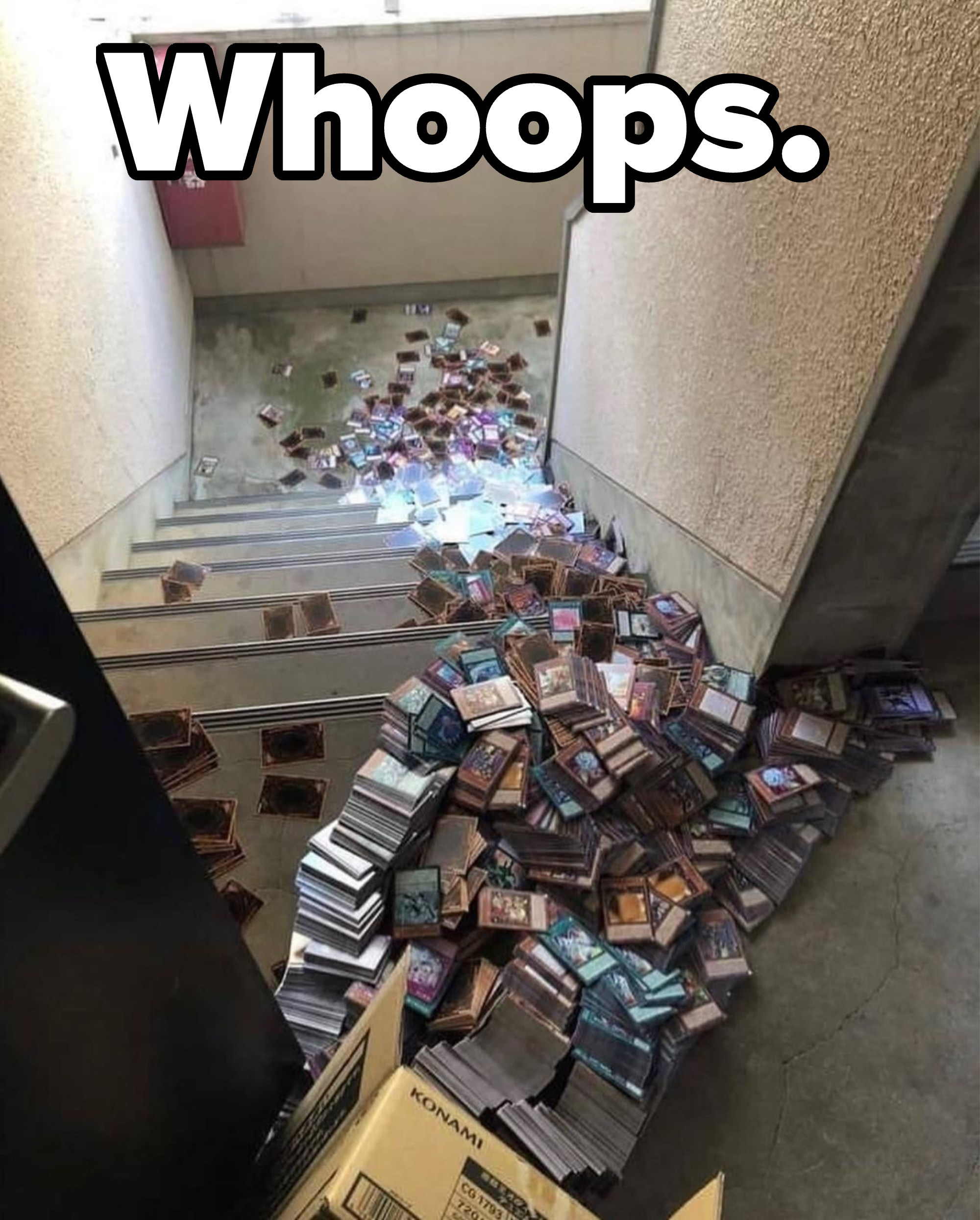 Hundreds of trading cards from a big box spill all down a flight of stairs