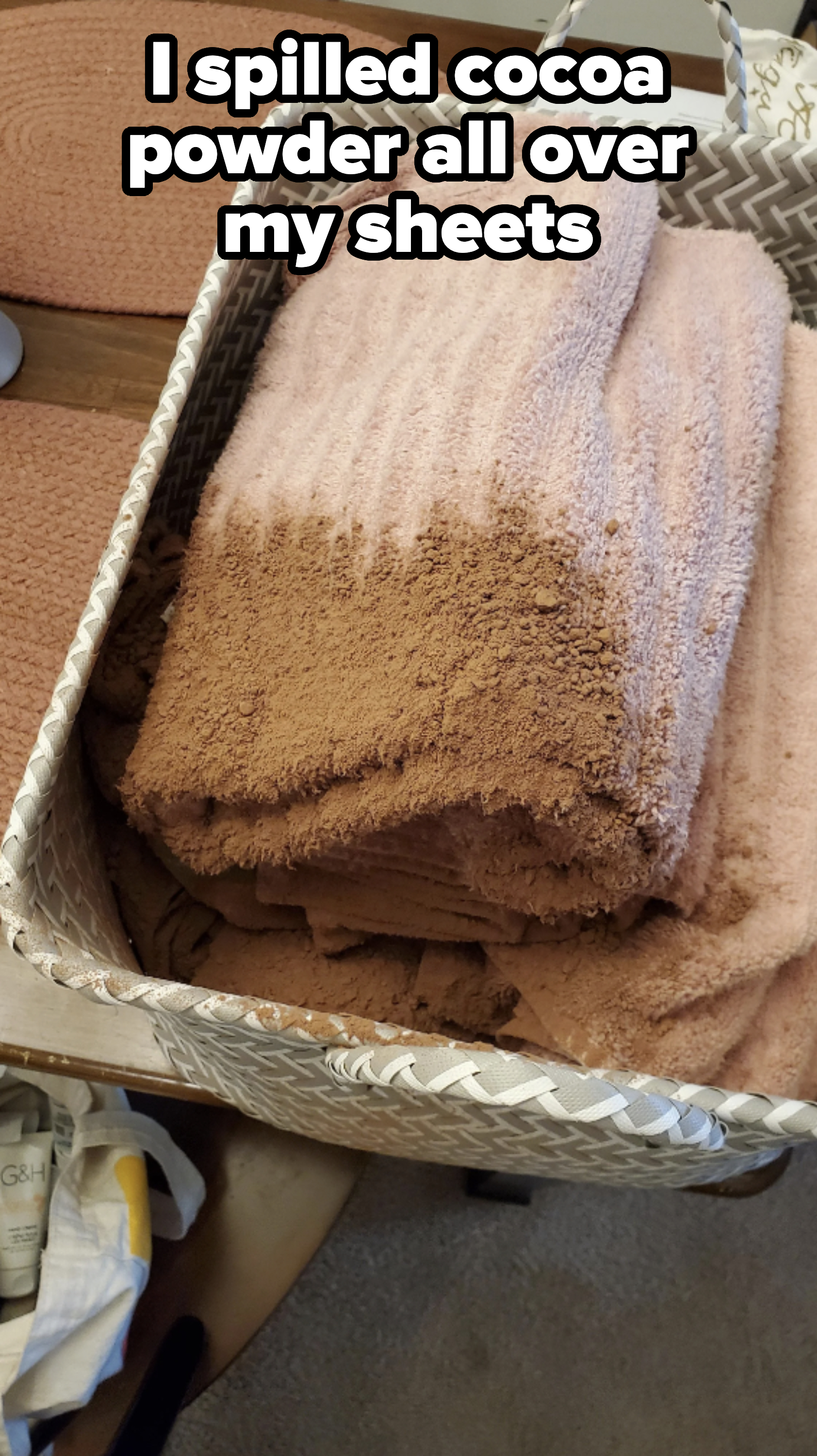 Sheets folded in a bin and covered in cocoa powder