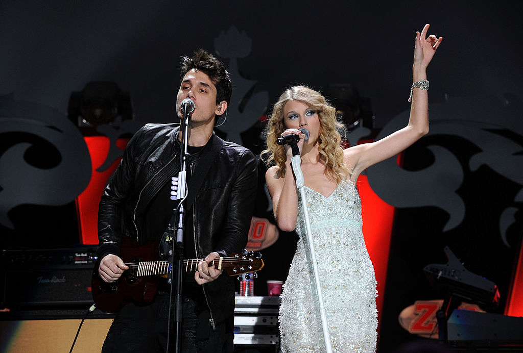 John and Taylor singing on stage