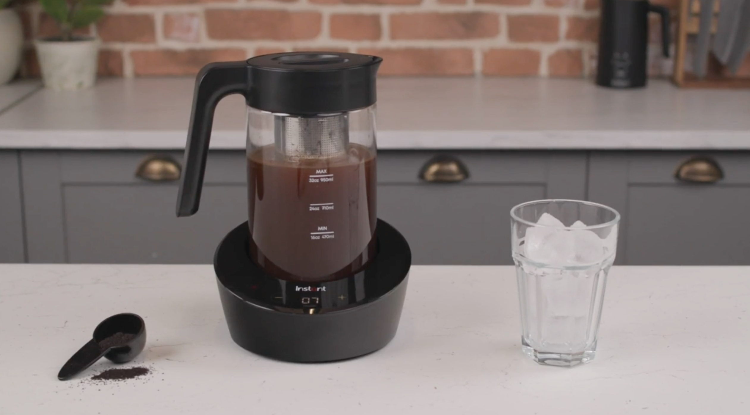 The cold brew maker featuring an electric base, a removable glass pitcher with a built-in coffee filter