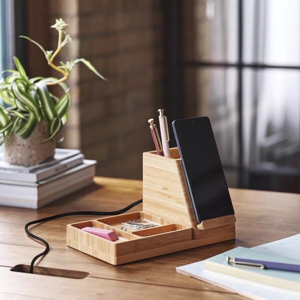 the bamboo wood charger stand on a desk