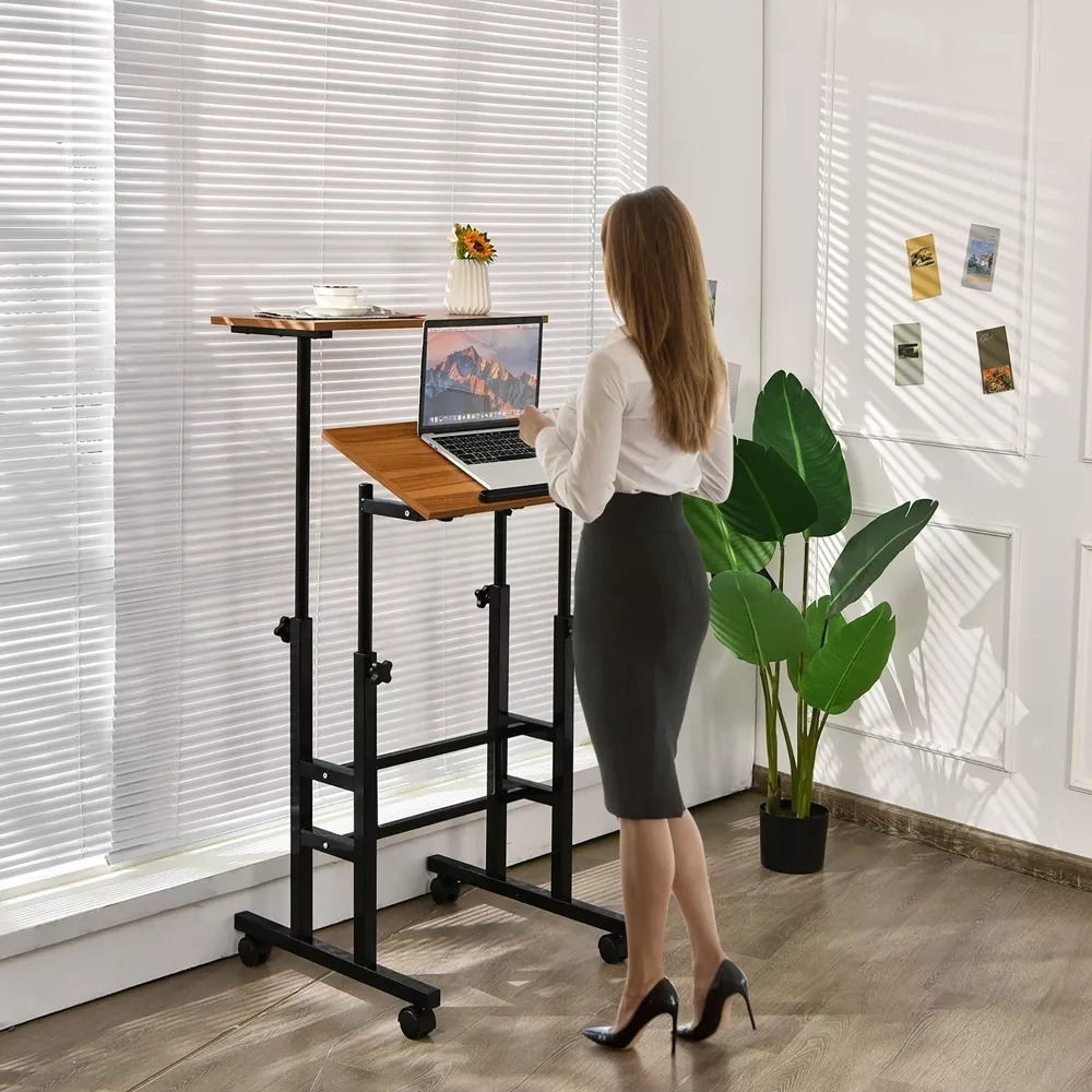 a model using the mobile work station in the standing position