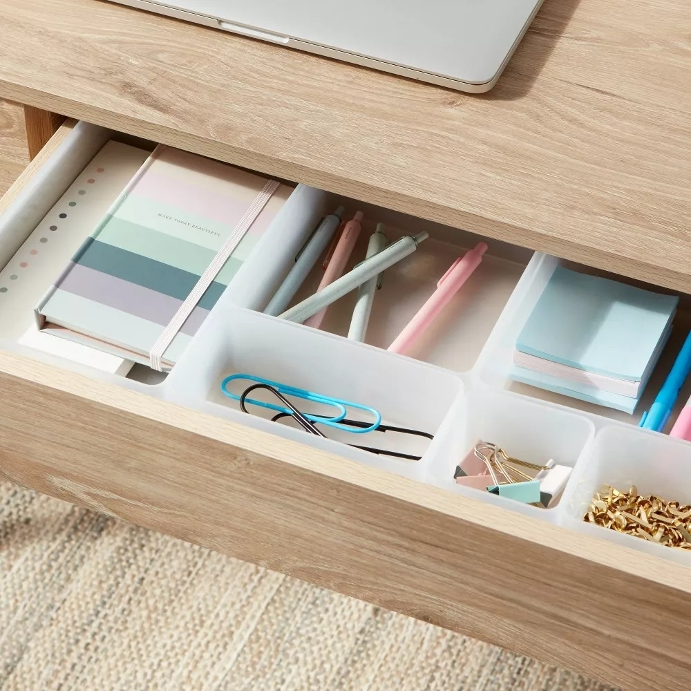 the white dividers slotted neatly into a drawer