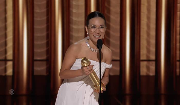 Closeup of Ali Wong holding her Golden Globe