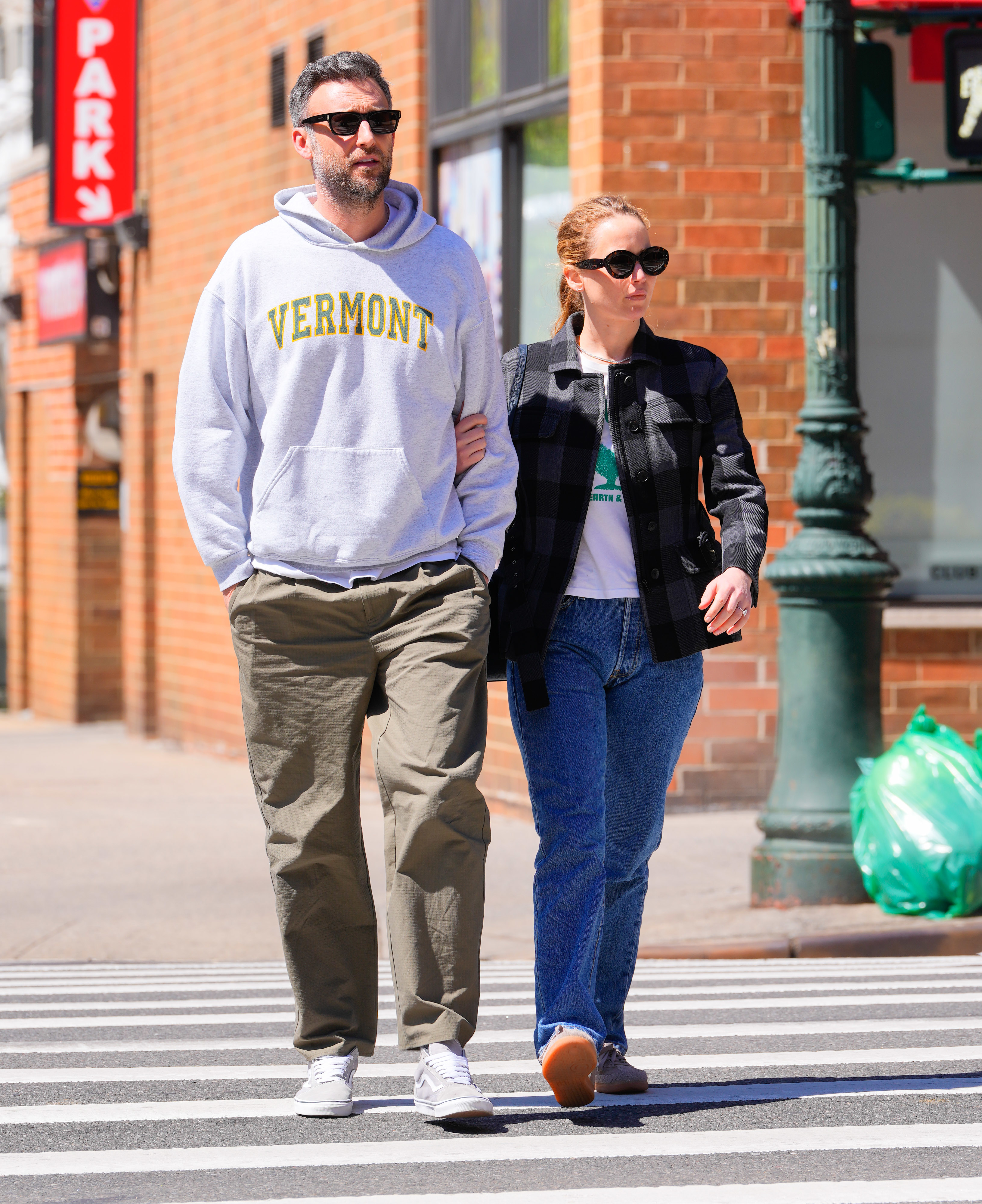 Cooke Maroney and Jennifer Lawrence walking down the street