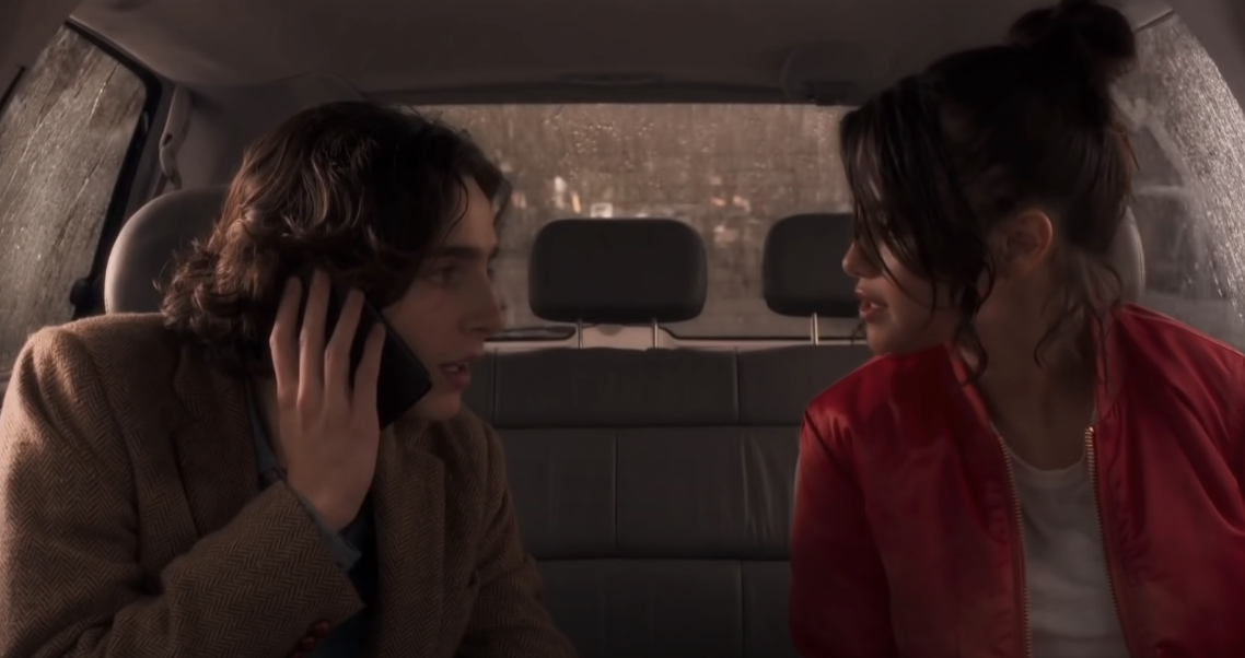 Timothée and Selena in a car in a scene from &quot;A Rainy Day in New York&quot;