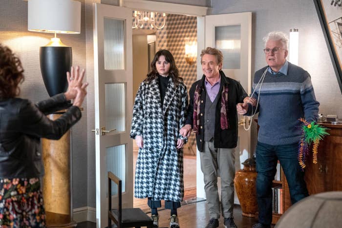 Selena standing next to Martin Short and Steve Martin in a scene from the show