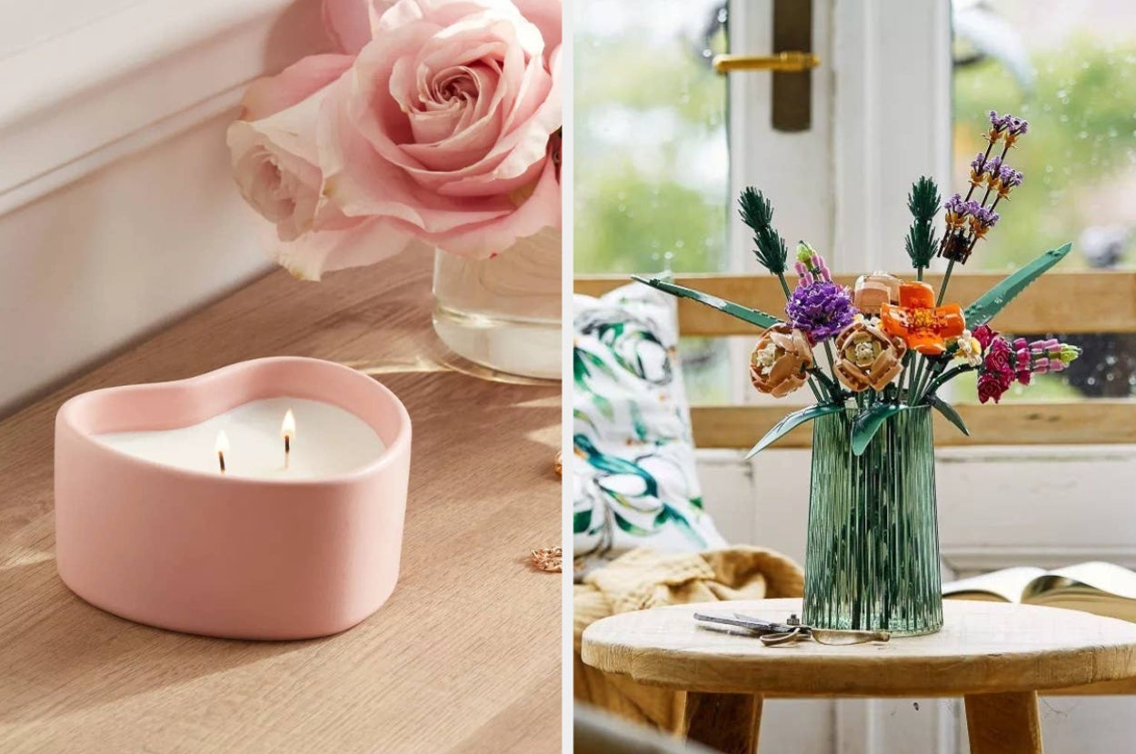 a pink heart shaped two wick ceramic candle on the left and a bouquet of Lego flowers on the right