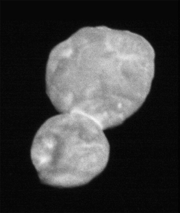 A fuzzy, black-and-white image of two spherical objects