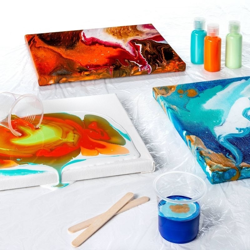 Painted canvases, paints, and art supplies