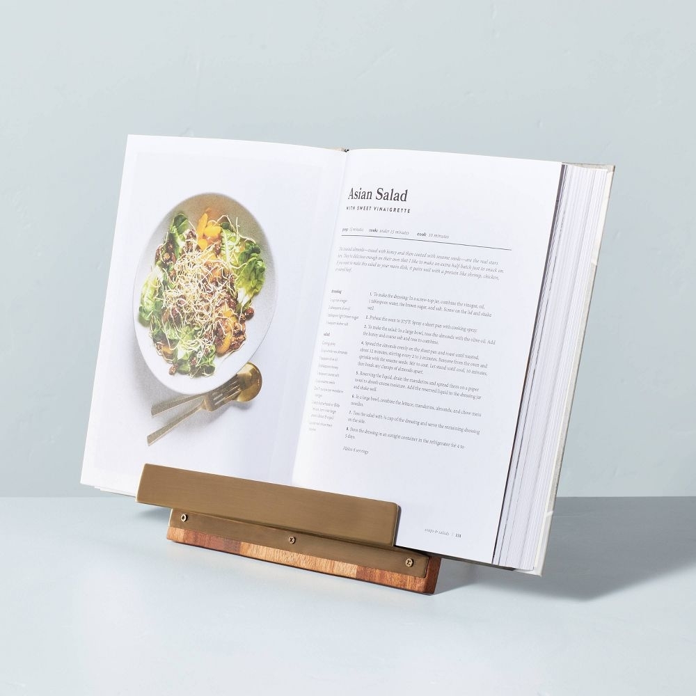 the cookbook stand with a cook book laying open on it