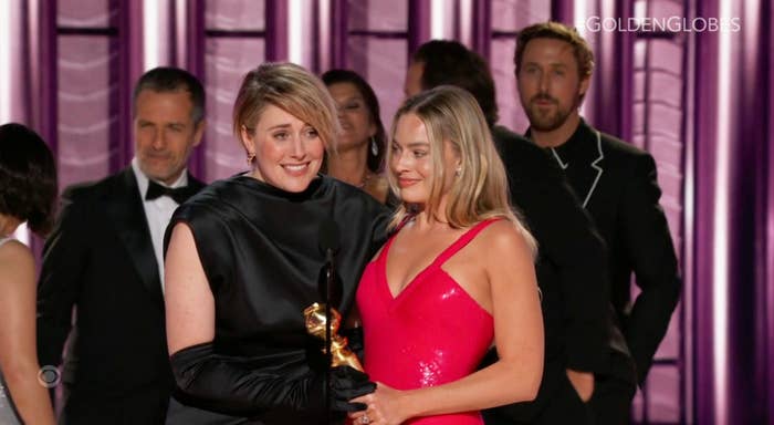Greta Gerwig and Margot Robbie accepting an award for &quot;Barbie&quot;