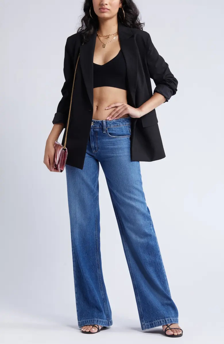 the black relaxed blazer open over a crop top
