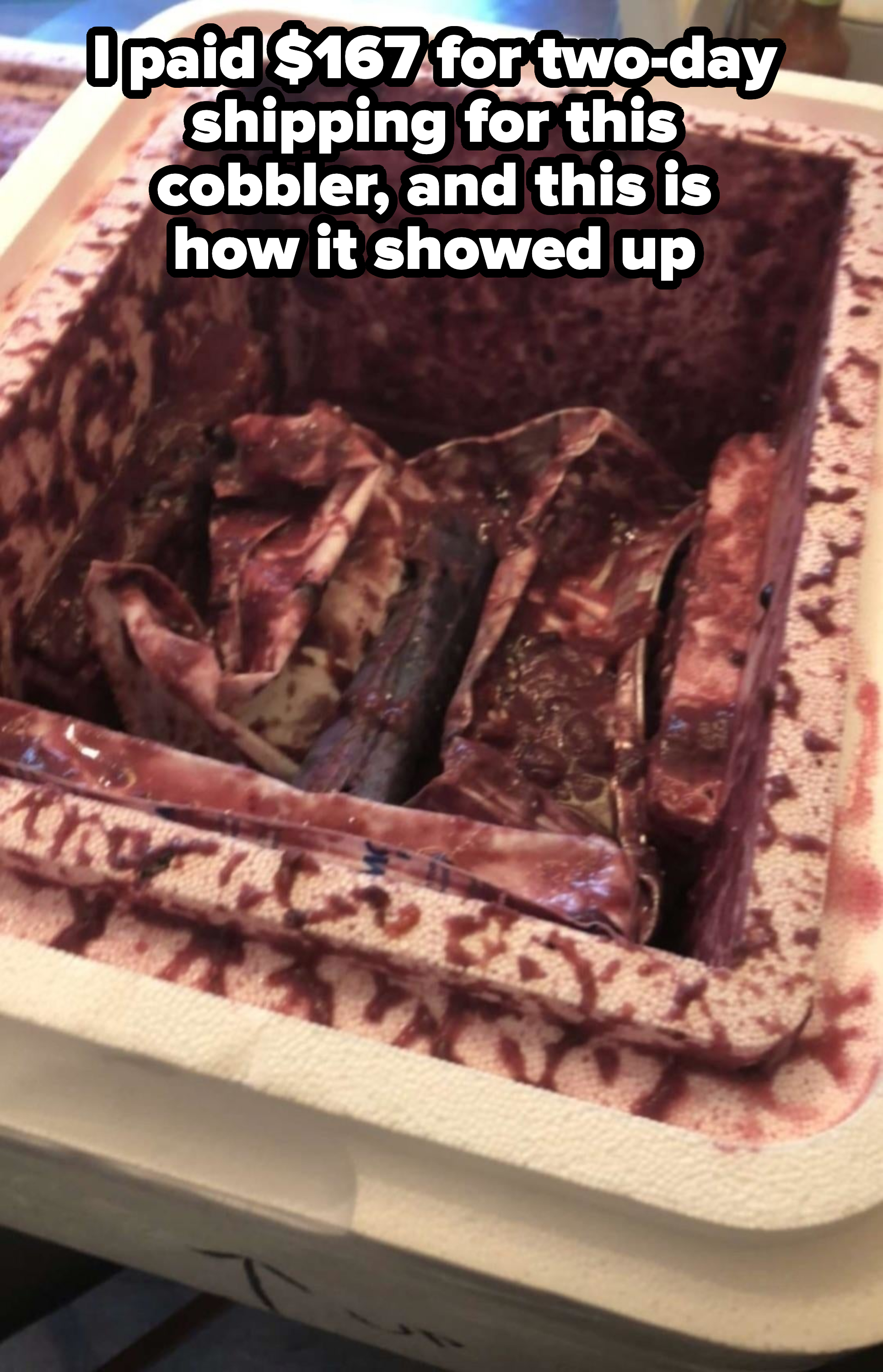 A caved-in cobbler, with caption: "I paid $167 for two-day shipping for this cobbler, and this is how it showed up"