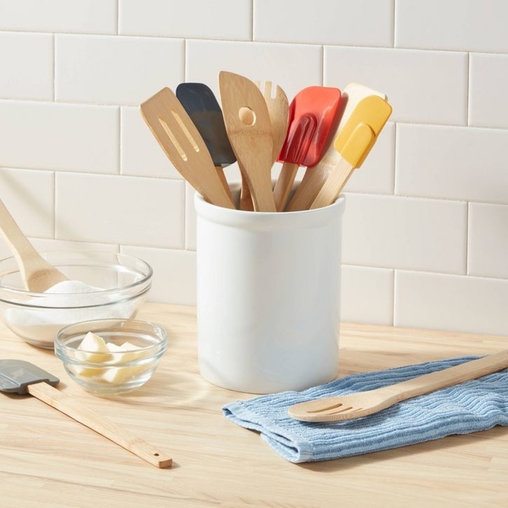 The colorful utensils in a holder