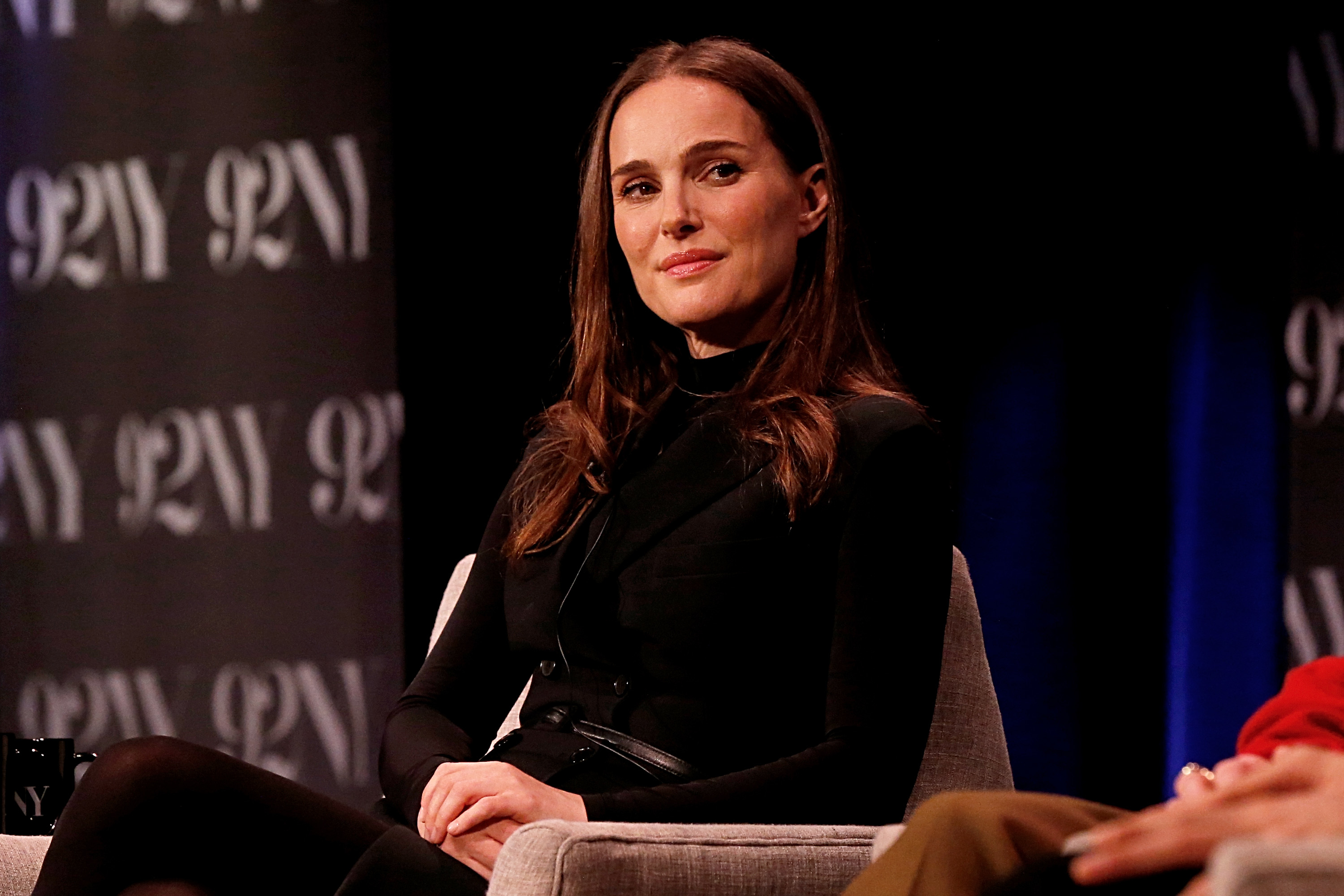 Natalie sitting onstage as part of a discussion