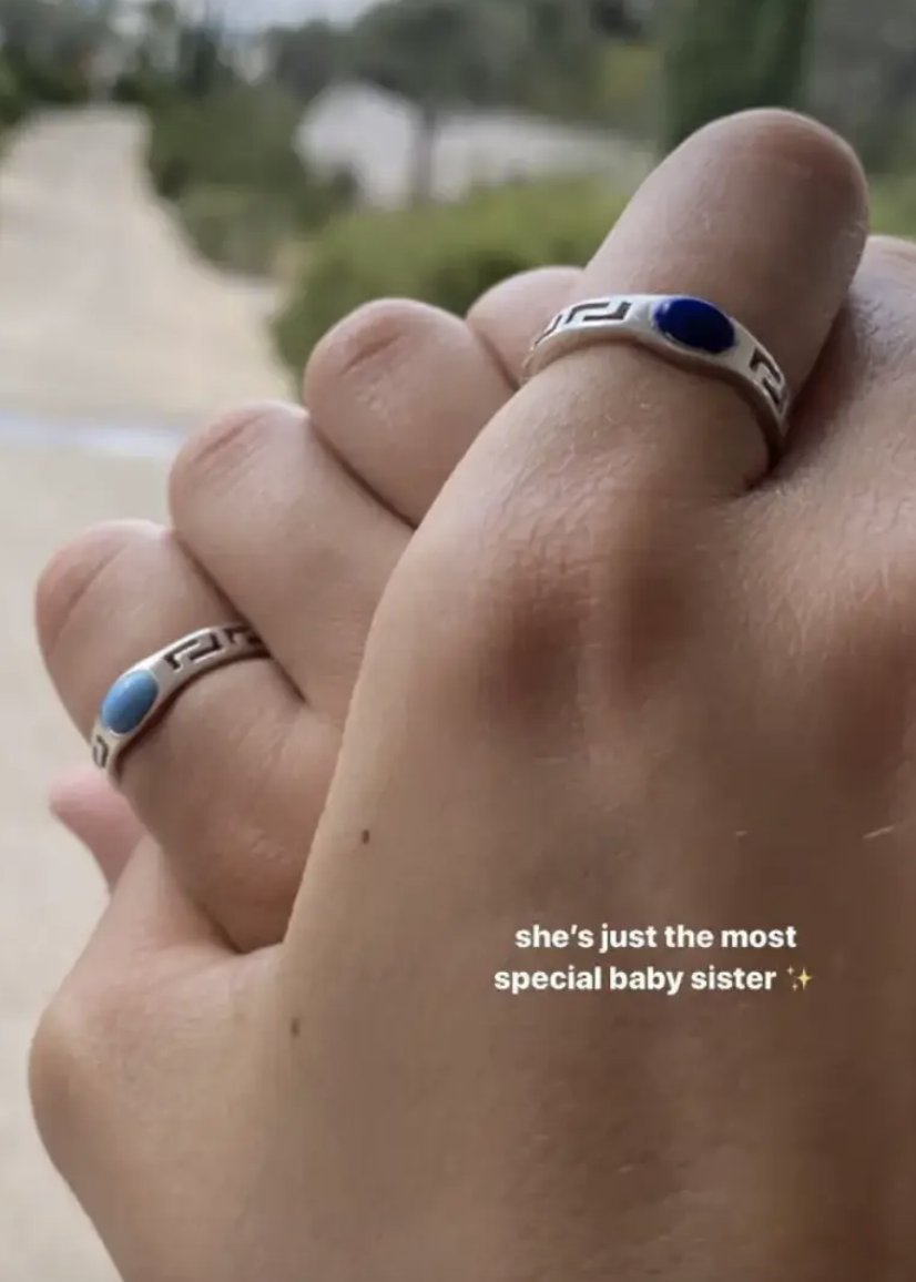 Nicola and Harper holding hands with the caption, &quot;she&#x27;s just the most special baby sister&quot;