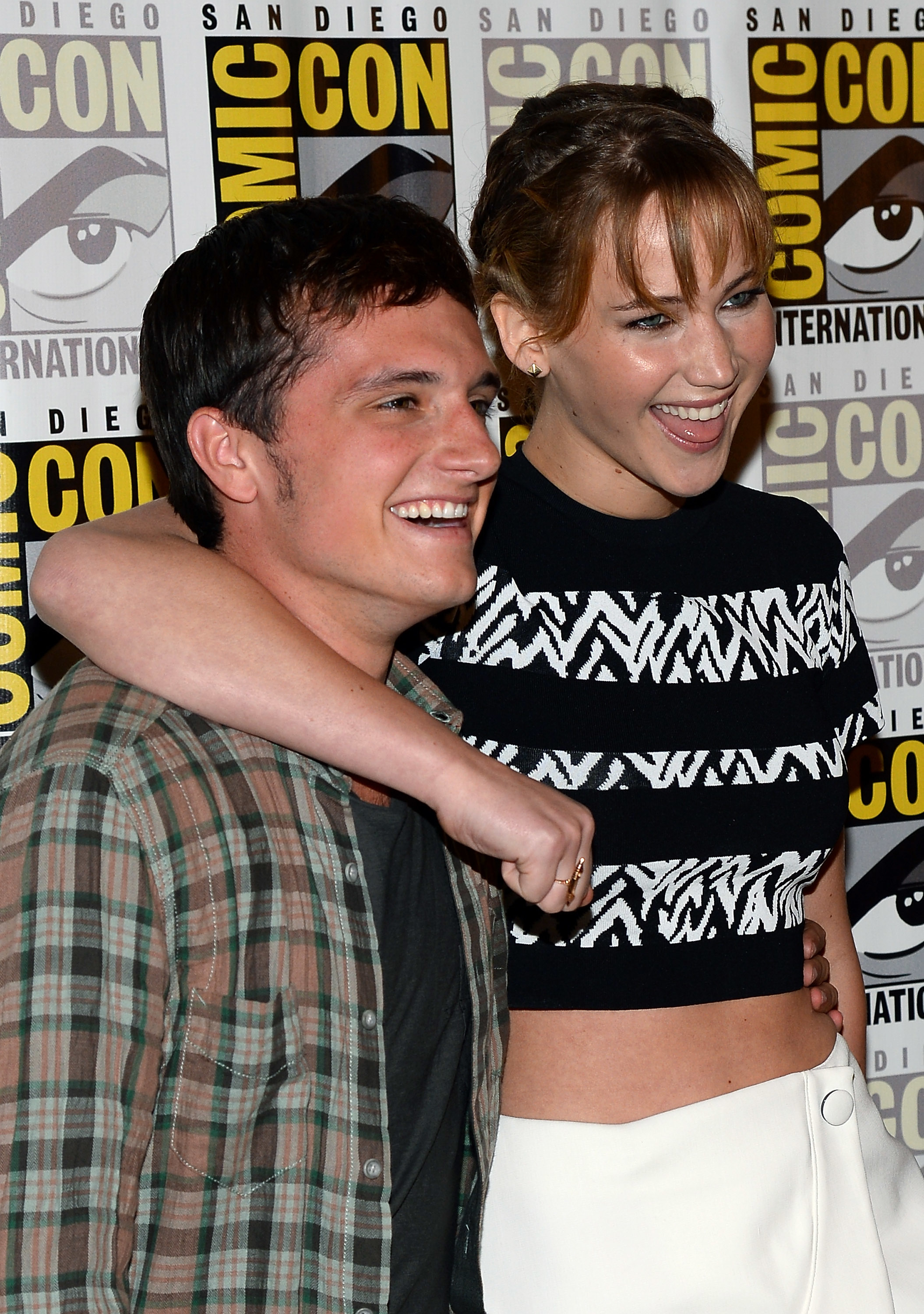 Jennifer smiles widely as she has her arm around Josh&#x27;s shoulders on the red carpet