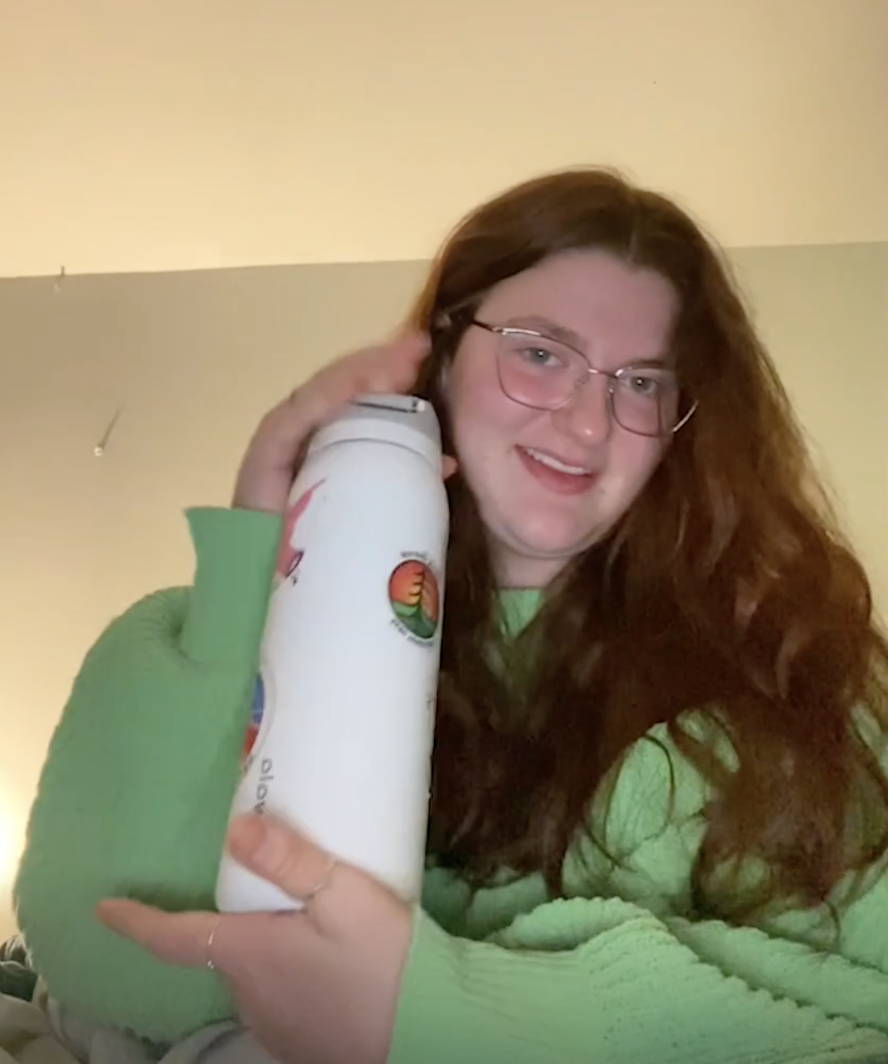 a girl holding her water bottle