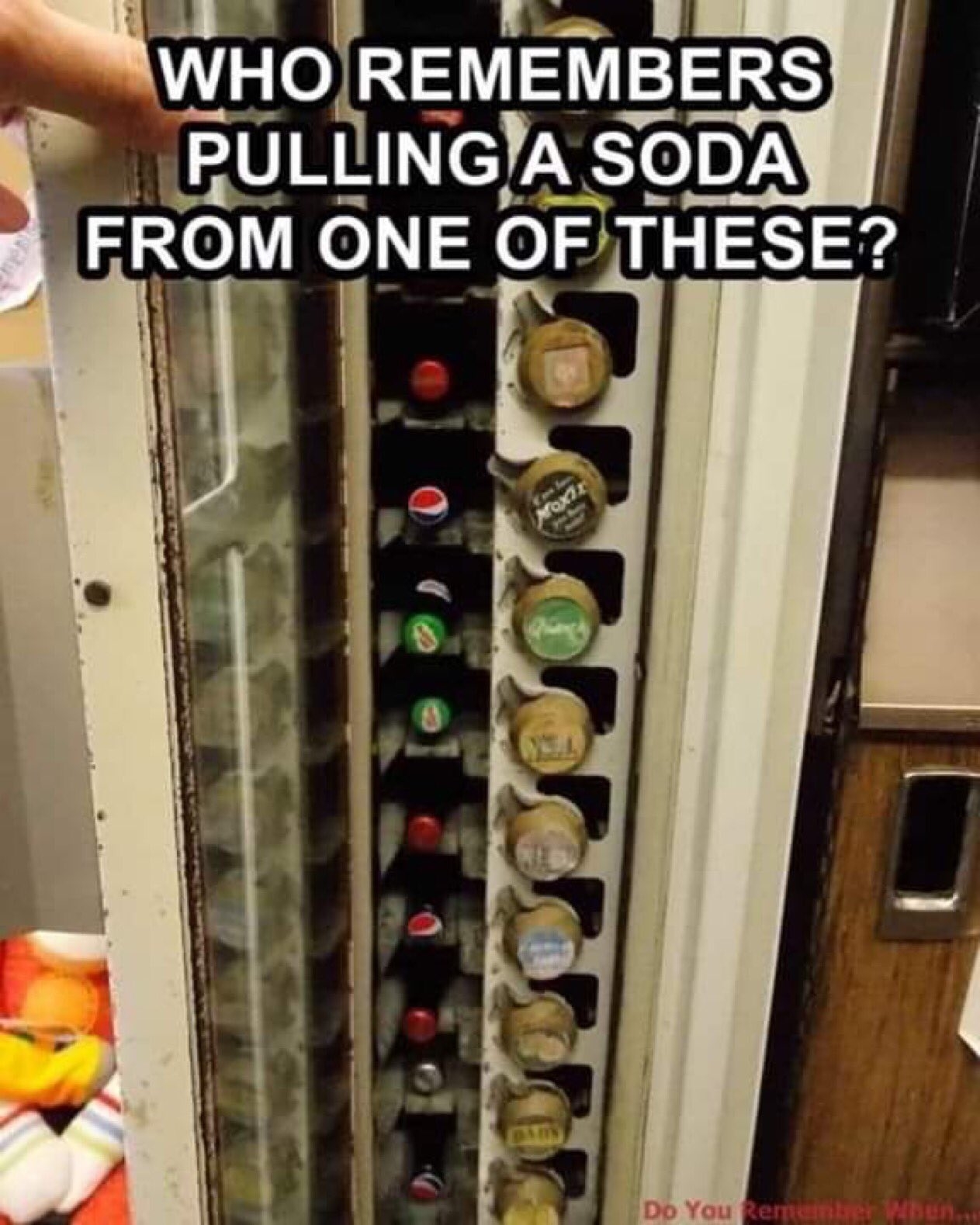 An old-school soda machine with cans in individual slots