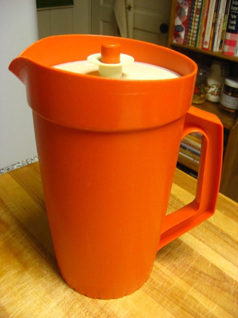 A bright orange plastic pitcher