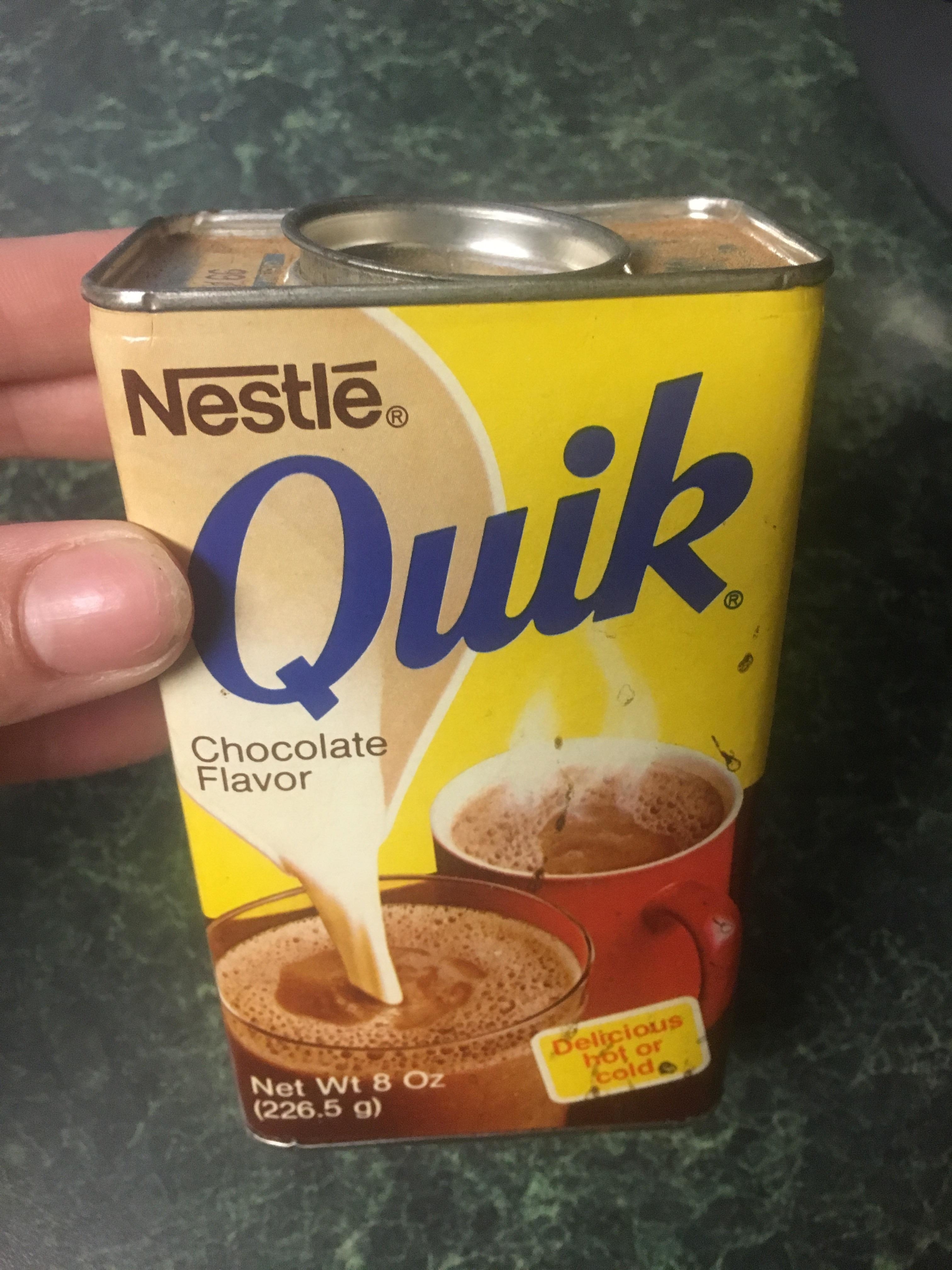 A container of Nestlé Quik chocolate flavor mix