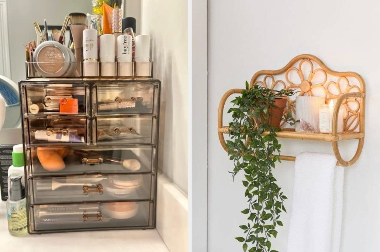 reviewer's bronze/clear makeup organizer with drawers open / rattan wall shelf in bathroom holding plant, ,hand towel, candles