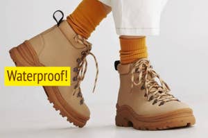 a model wearing tan lace-up boots with teext reading "waterproof!"