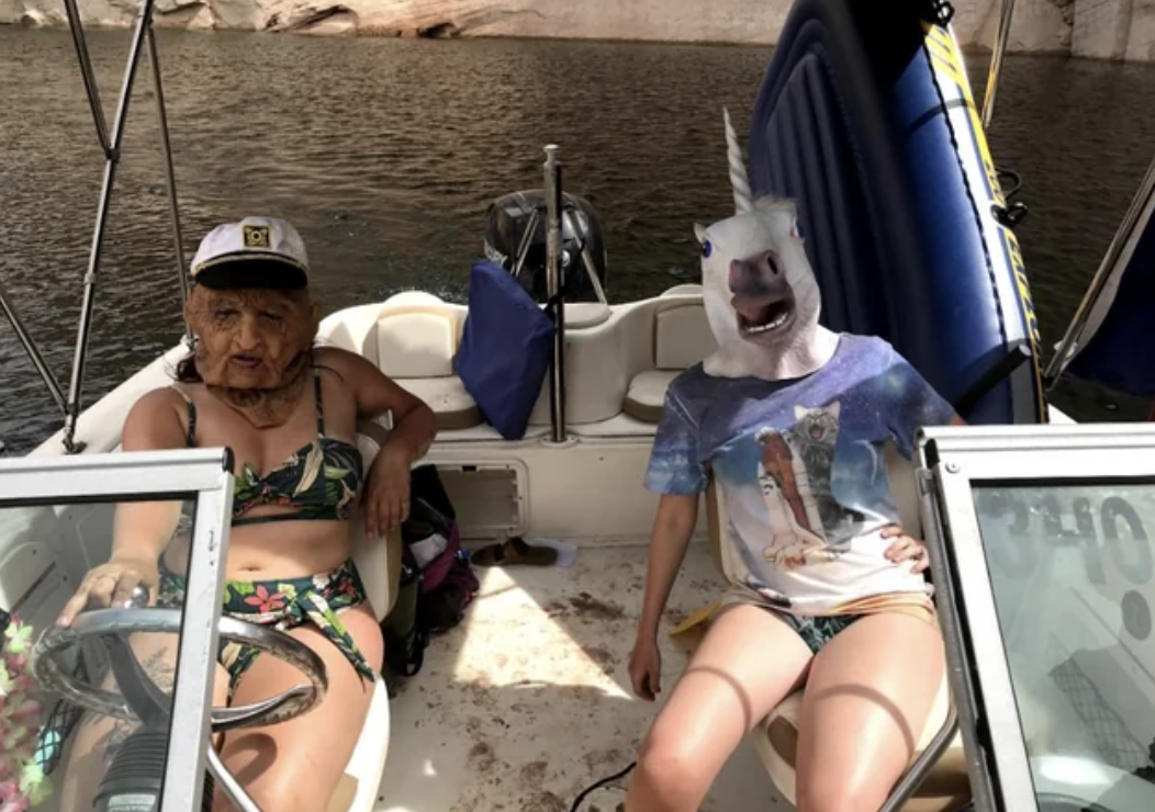 People on a boat wearing scary masks