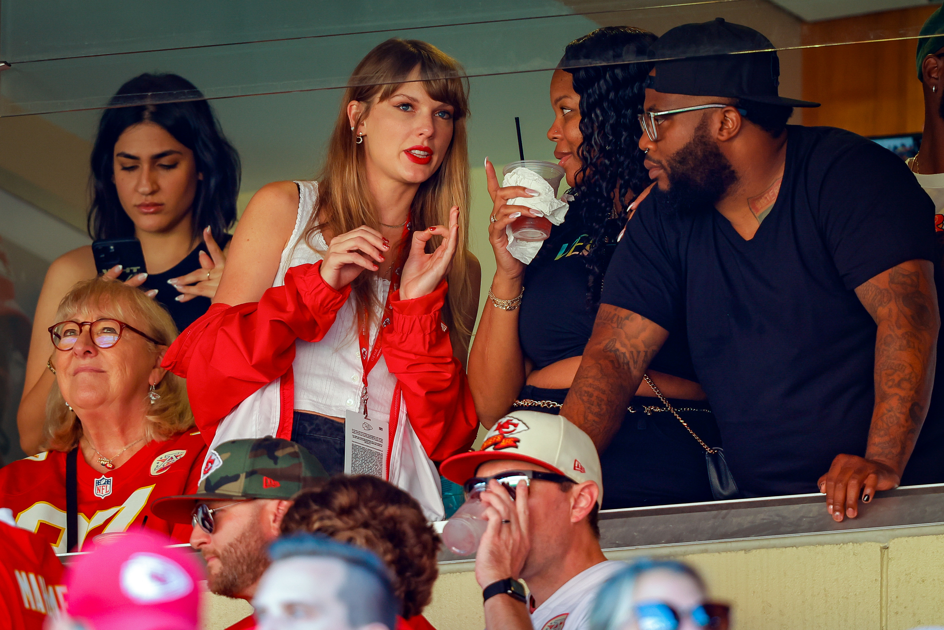 Close-up of Taylor in a VIP booth at a game