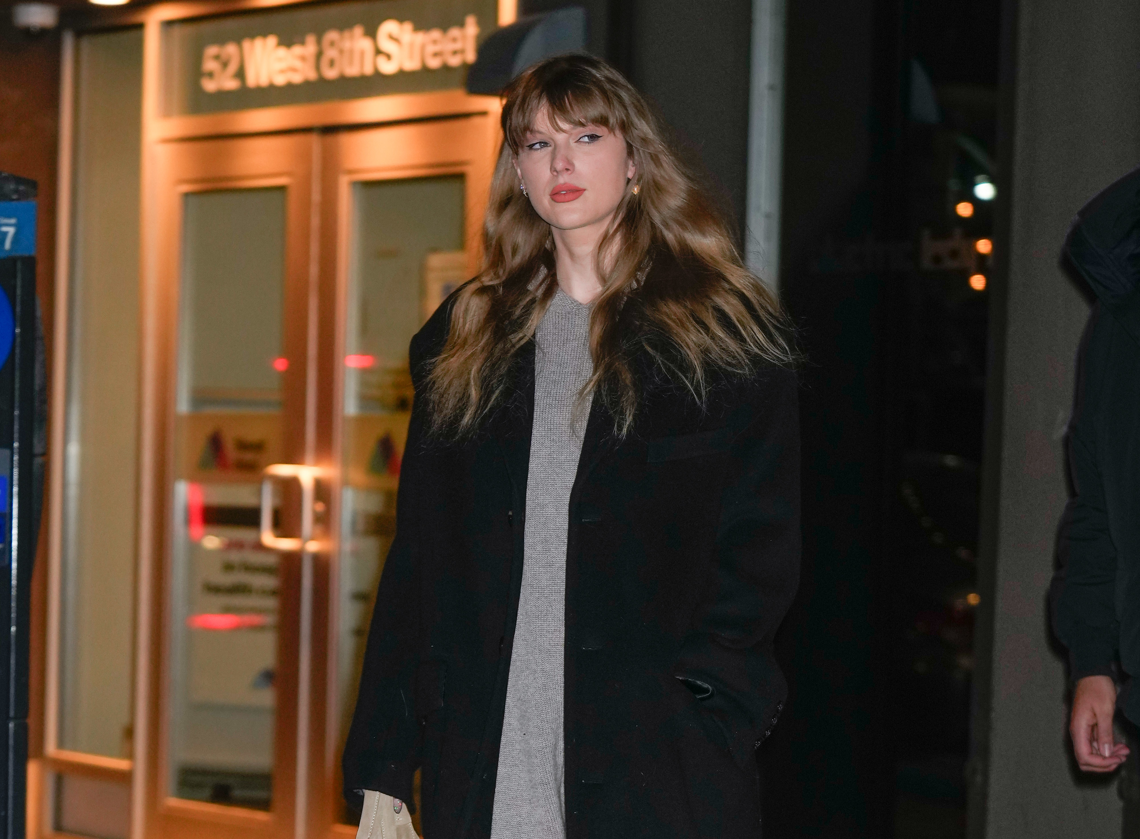 Close-up of Taylor outside a building