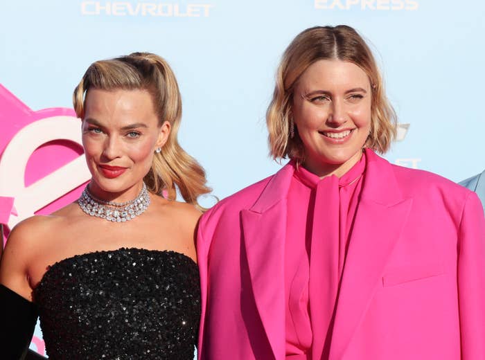 Margot and Greta smiling at a Barbie event
