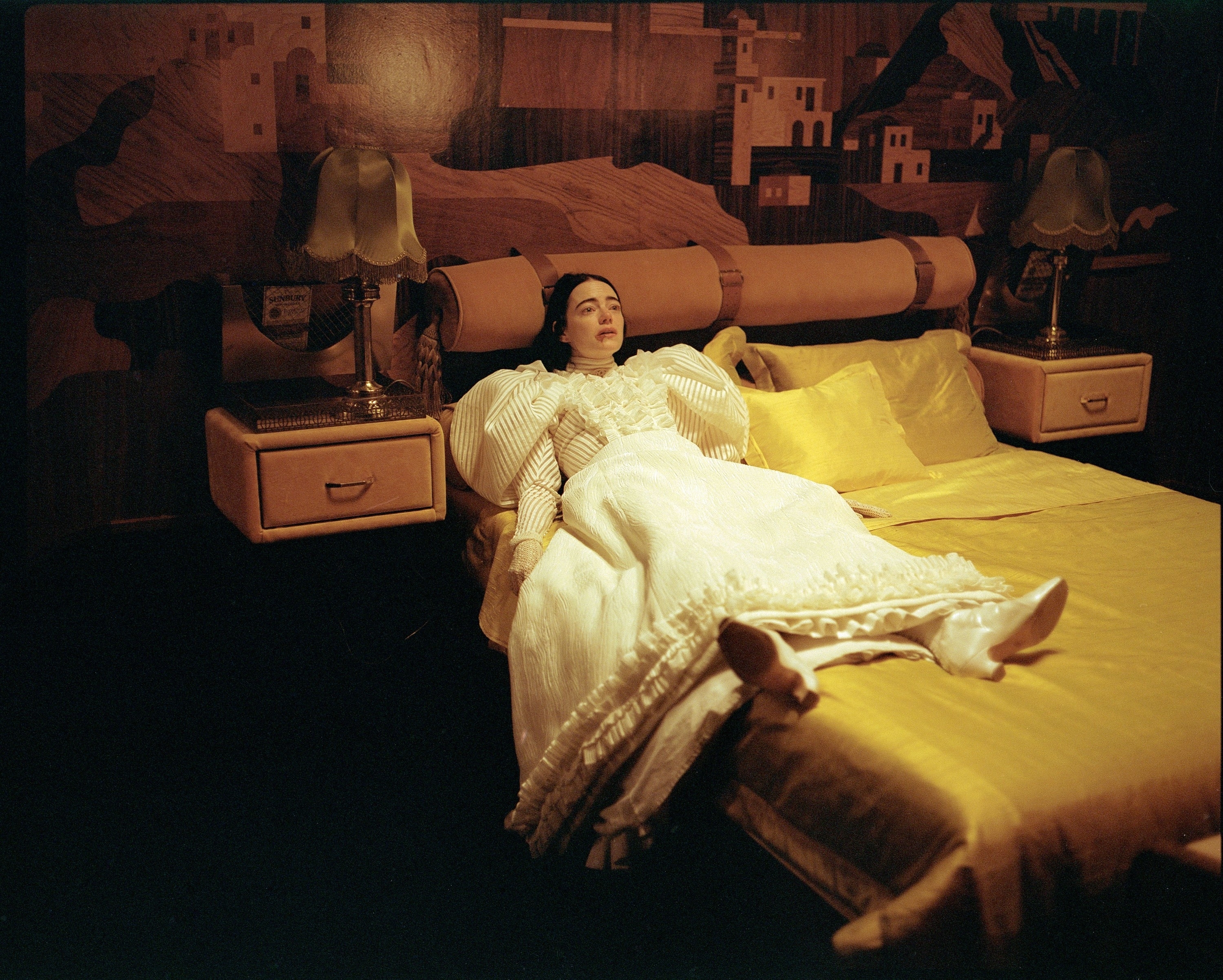 Bella in bed in a scene from &quot;Poor Things&quot;