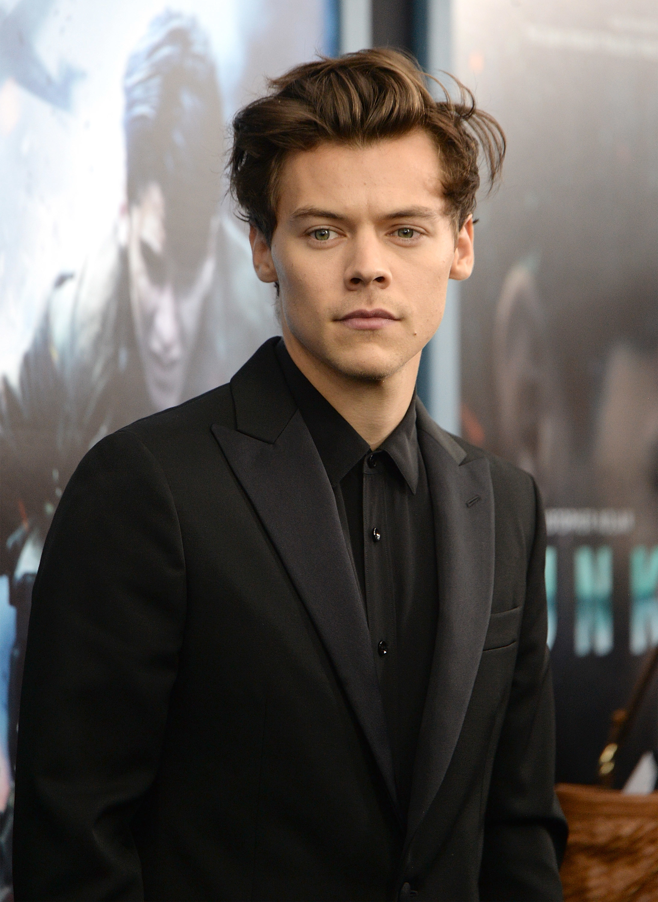 he&#x27;s wearing a suit at a movie premiere